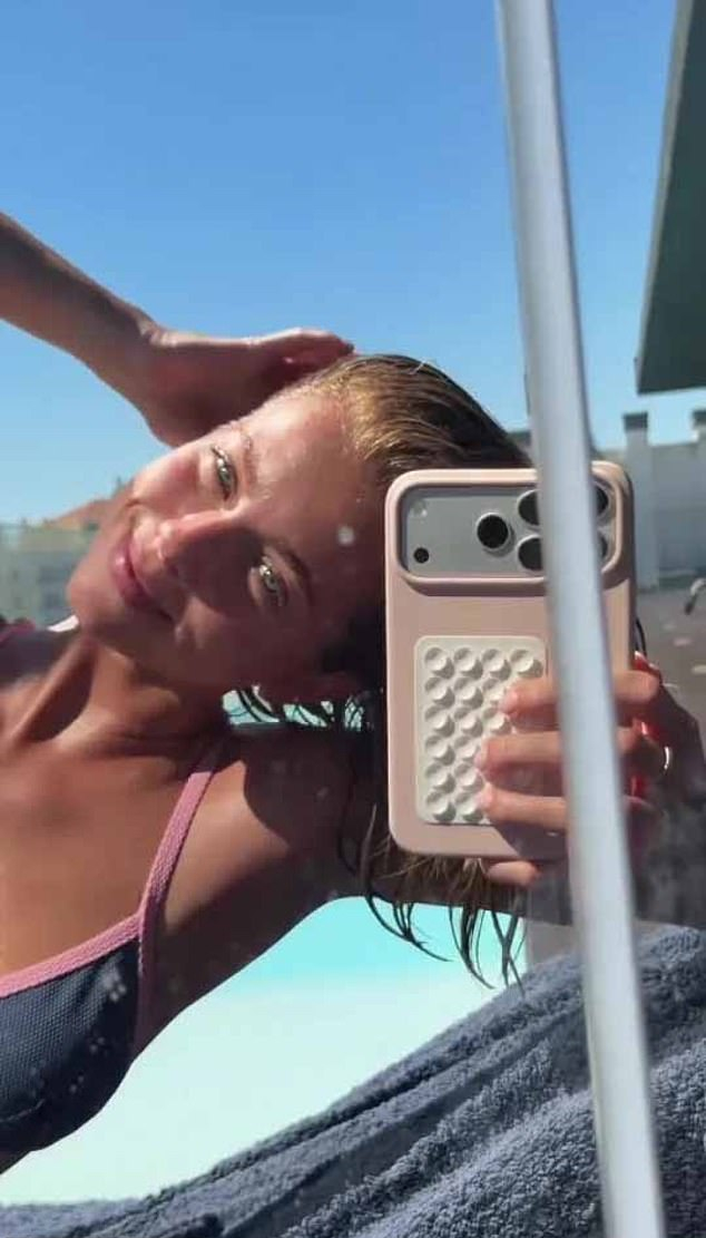 Margarida went makeup-free for the tanning session, sweeping her blonde locks into a messy bun